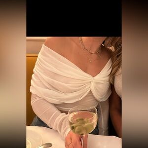 Sheet draped white off the shoulder long sleeve top